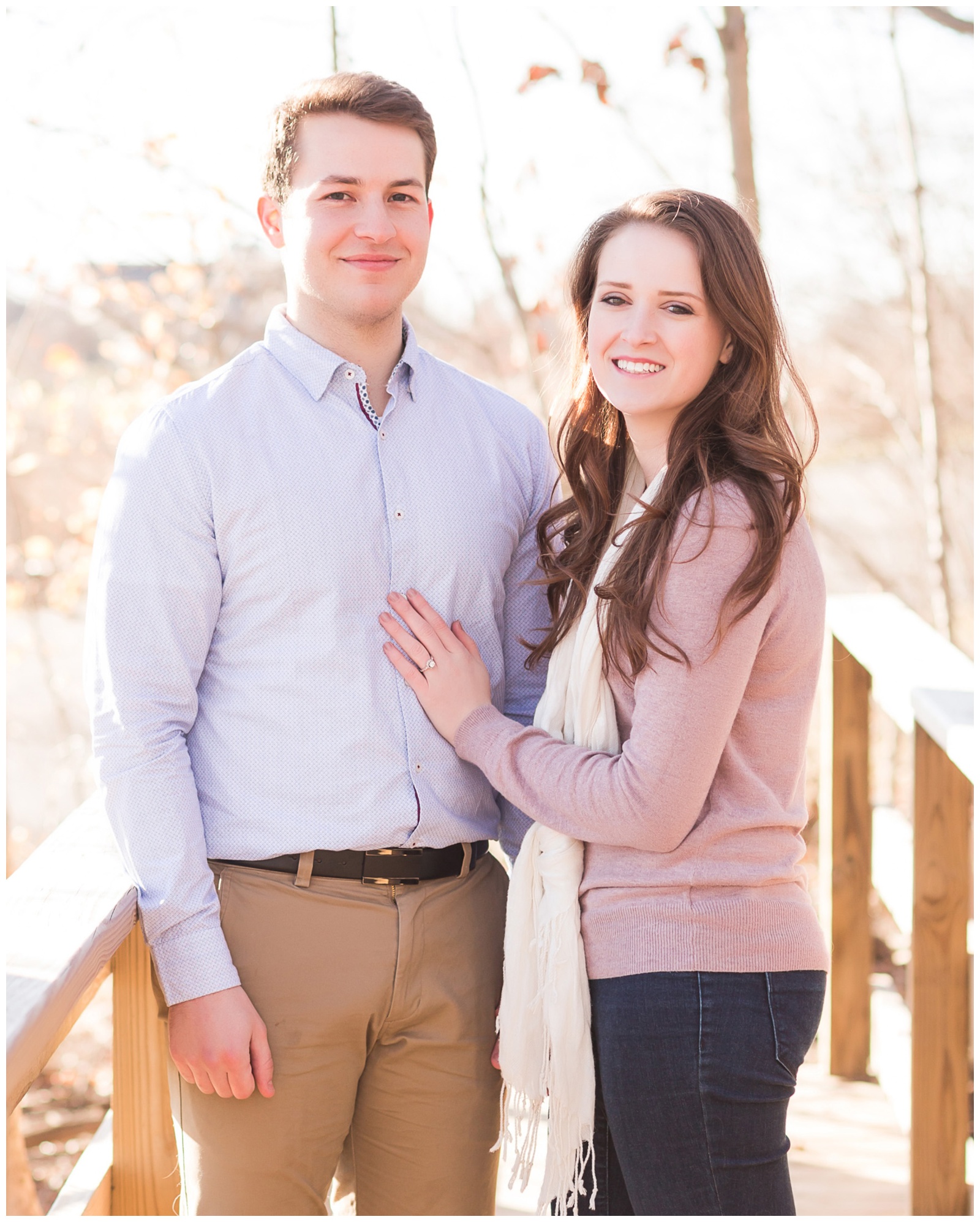 Couple standing on bridge