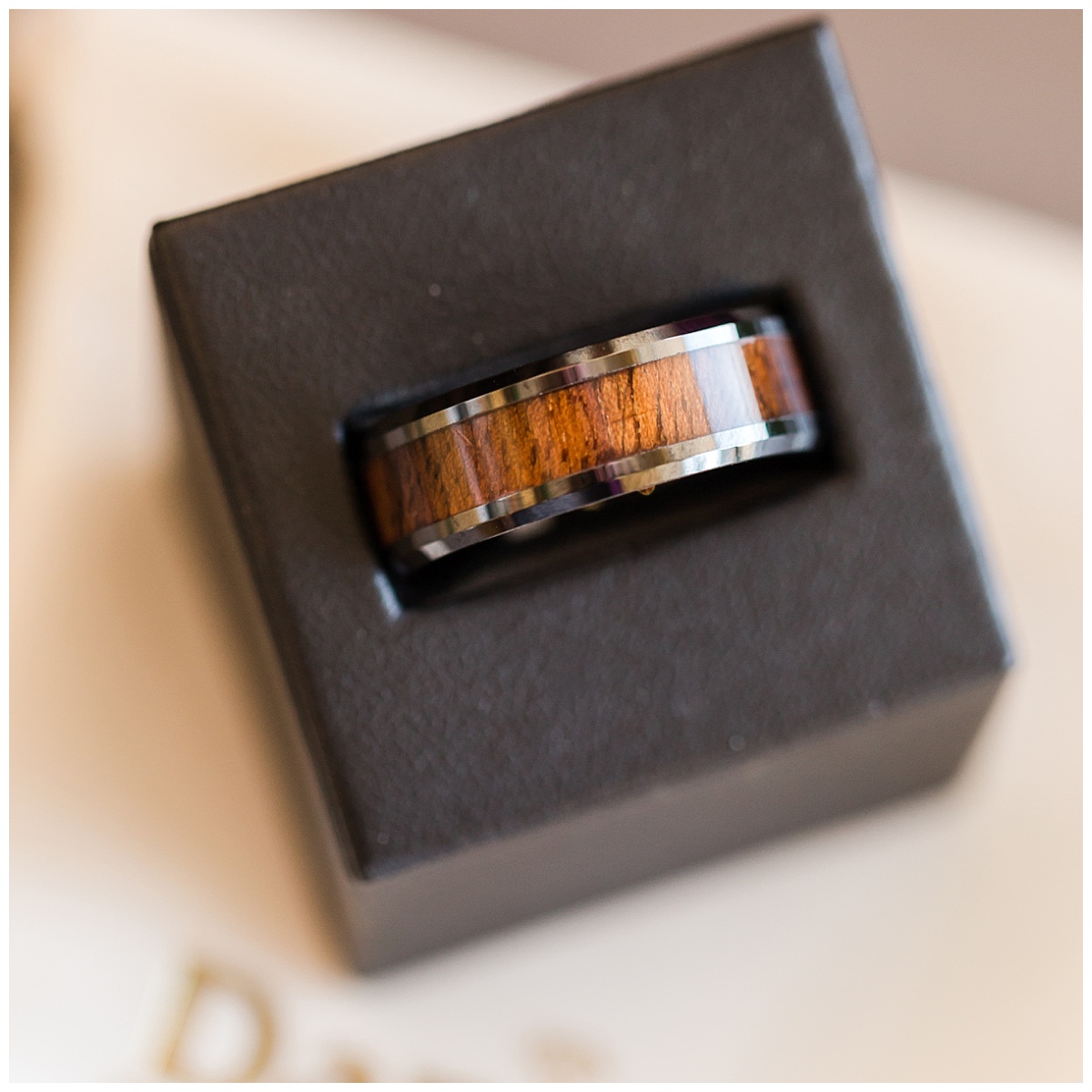 mans wedding ring with wood inlay