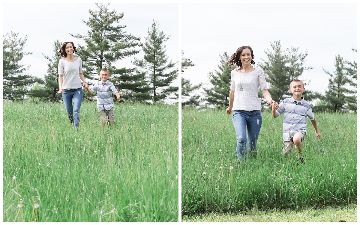 mother son running down grassy hill