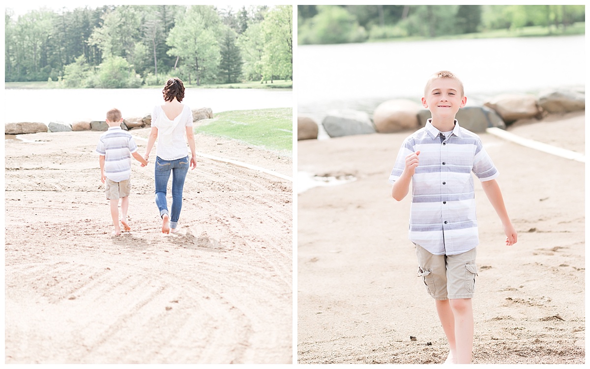 mother and son walking along beach