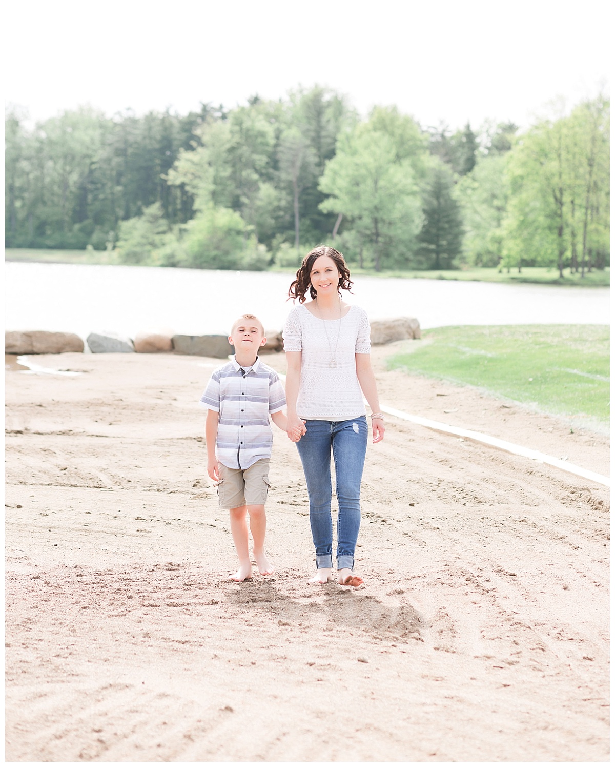 mother and son walking along beach