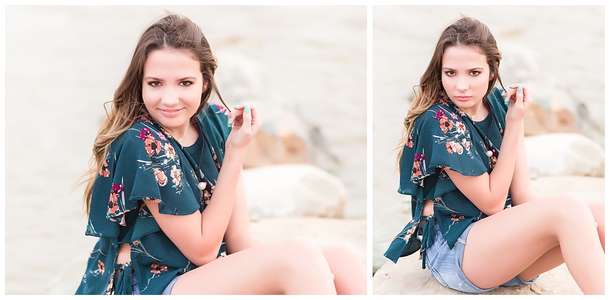 senior girl sitting on rocks near beach 
