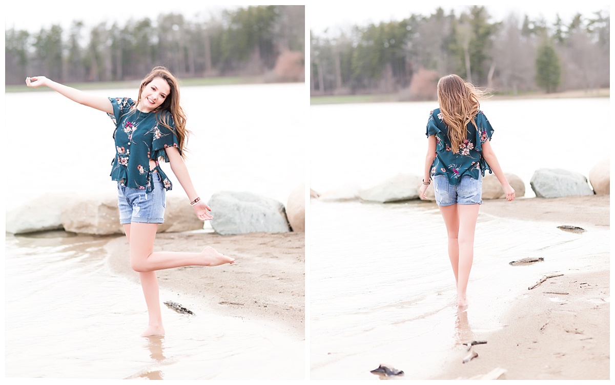 senior girl walking along shore
