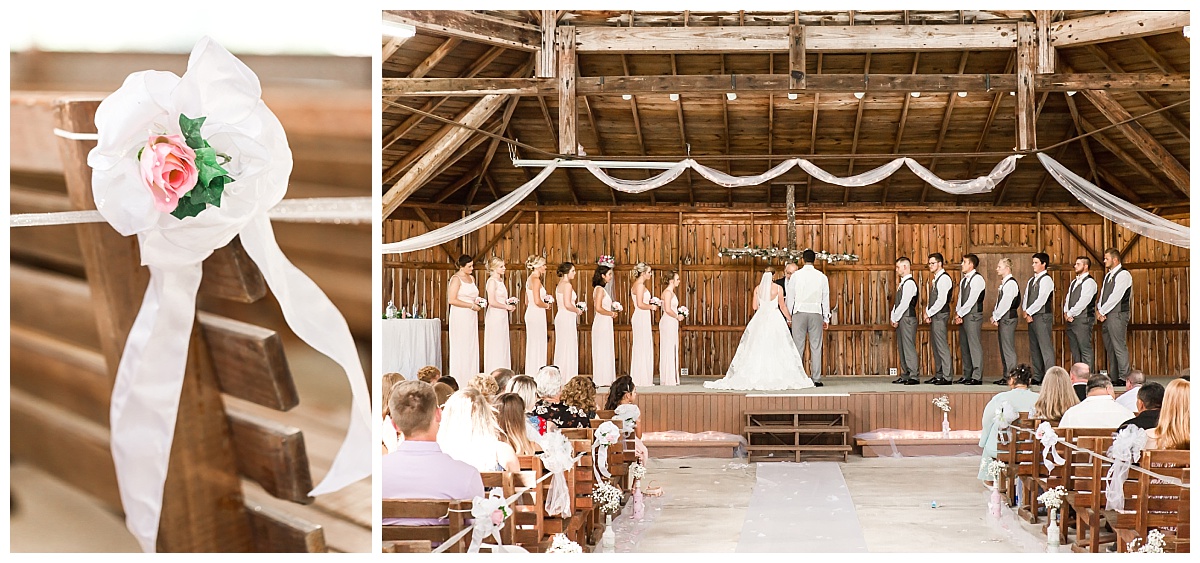 pew decoration pink flower and white bow | wedding ceremony full bridal party in view