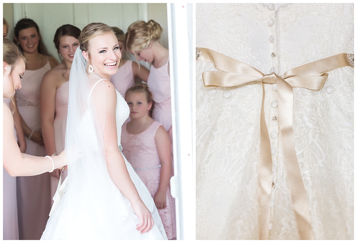 bridesmaid in pink dress tying bow of brides wedding dress | close up of bow detail on wedding dress