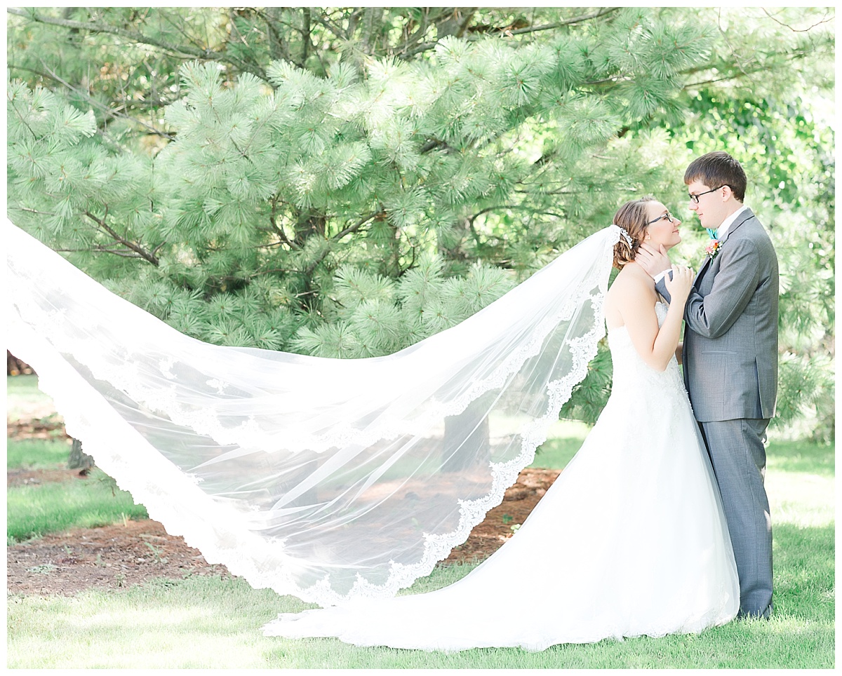 cathedral length bridal veil| bride and groom| teal and coral wedding with gray tux