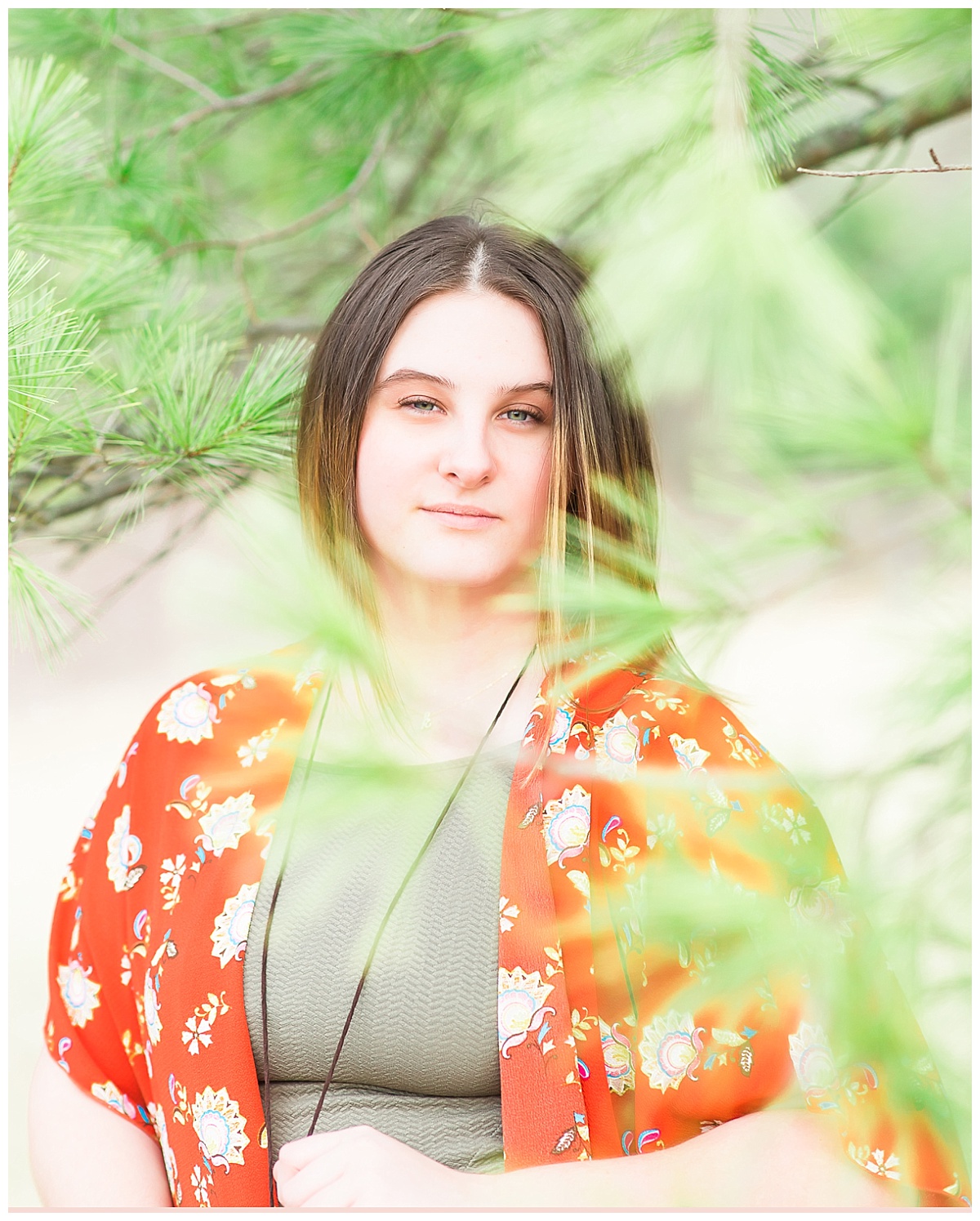 Senior girl near pine tree photo by Simply Seeking Photography