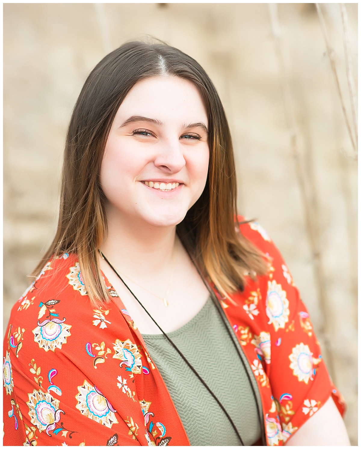 Senior girl in tall grasses photo by Simply Seeking Photography