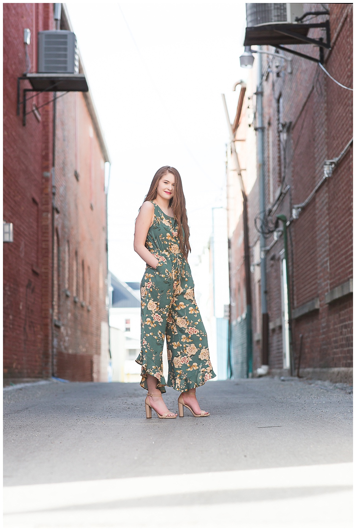 Senior girl between downtown buildings