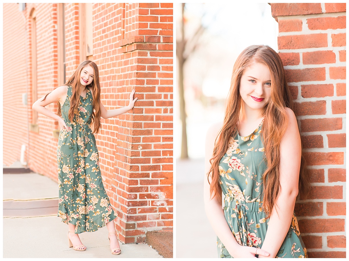 senior girl downtown near brick buidlings