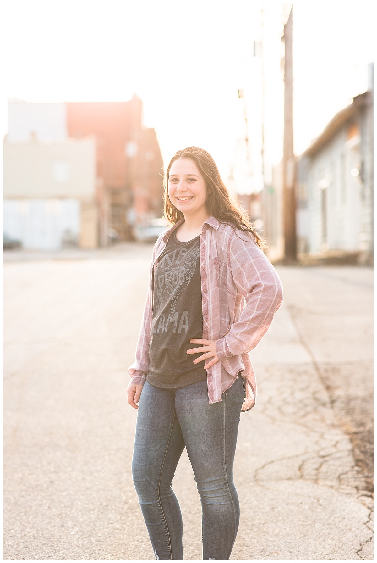 senior girl downtown at sunset
