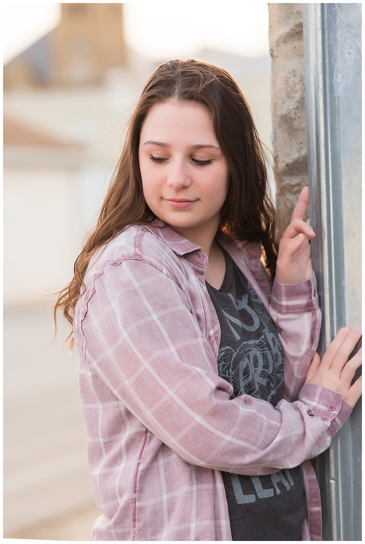 senior girl near metal building