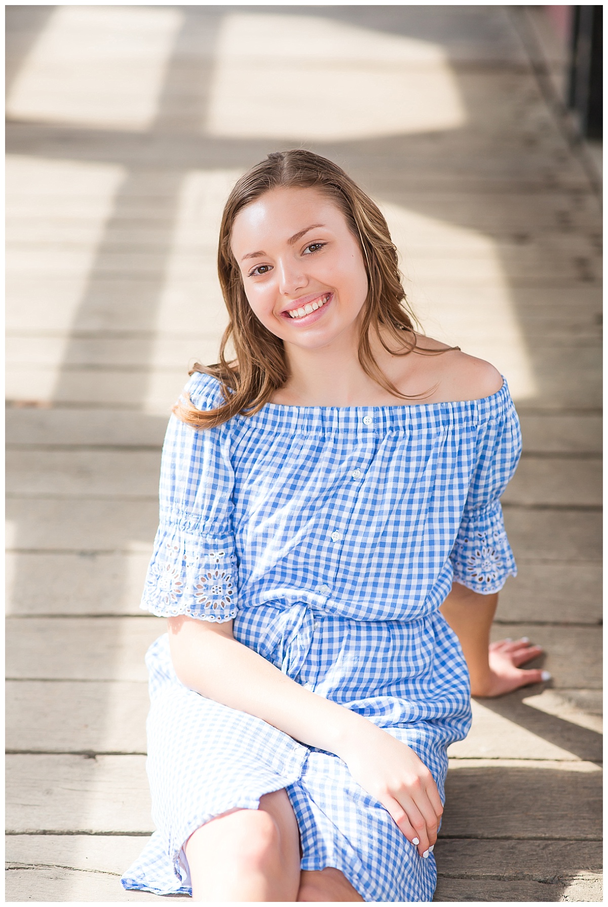 senior girl on wooden bridge