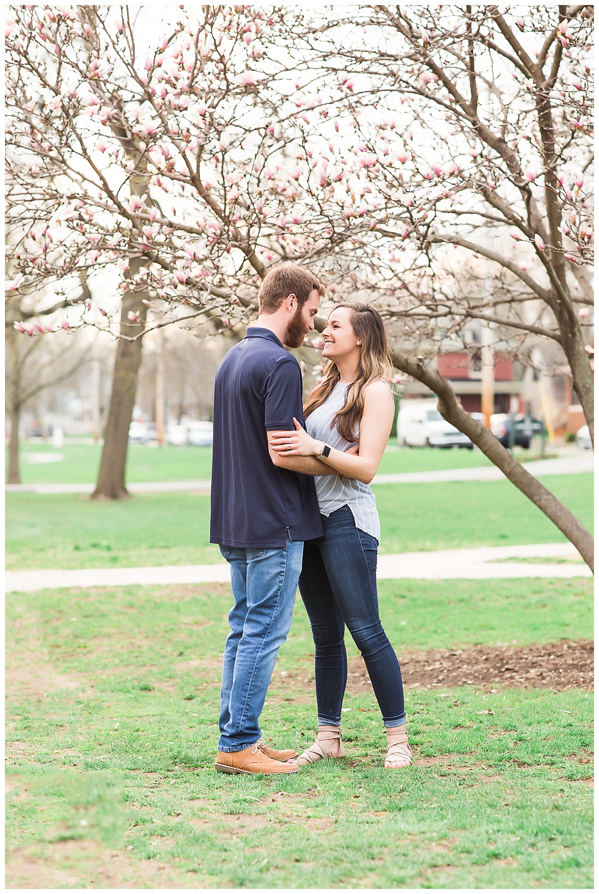 Couple standing together under tulip tree
