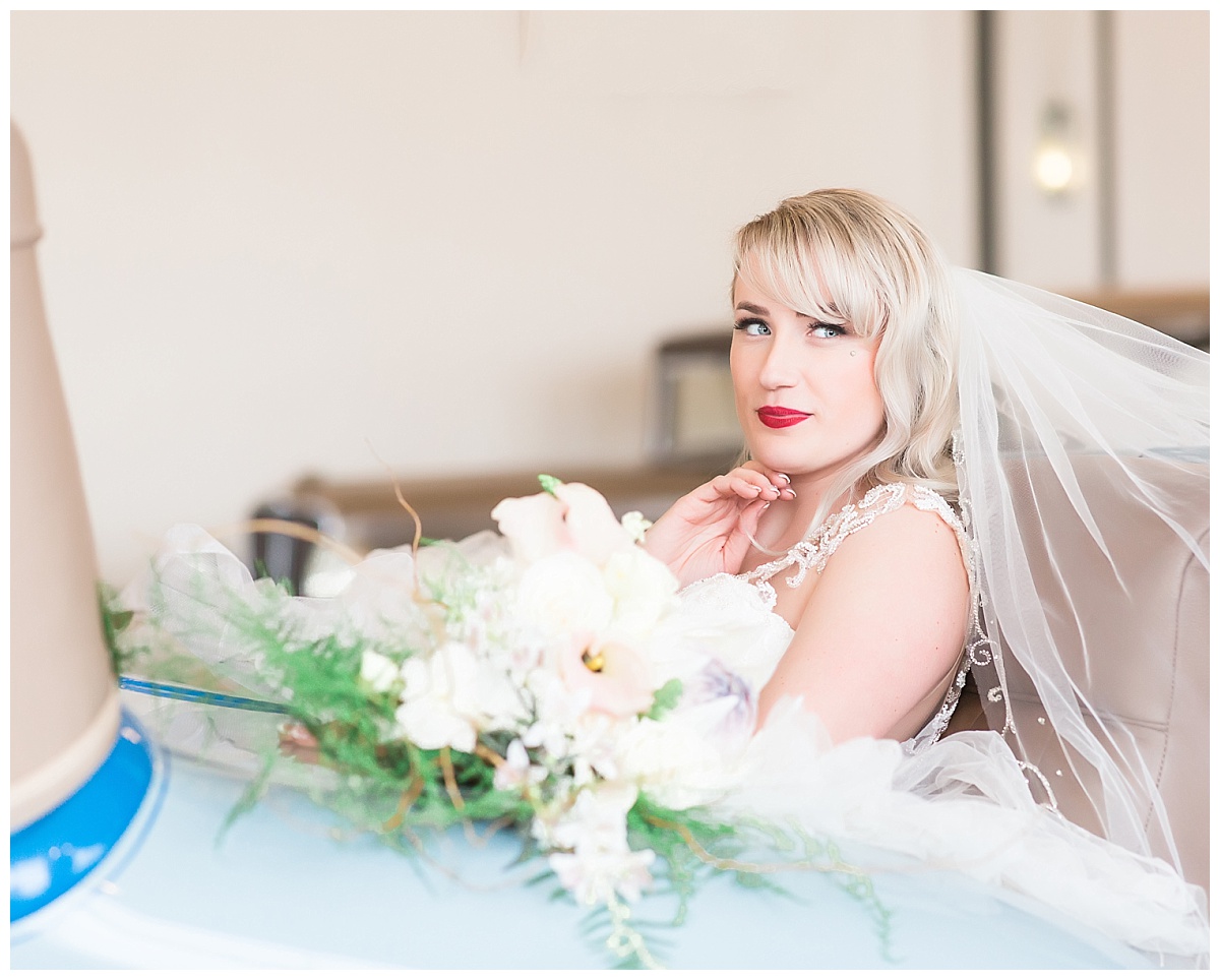 Bride in vintage car at Auburn Cord Duesenberg Museum wedding photo by Simply Seeking Photography