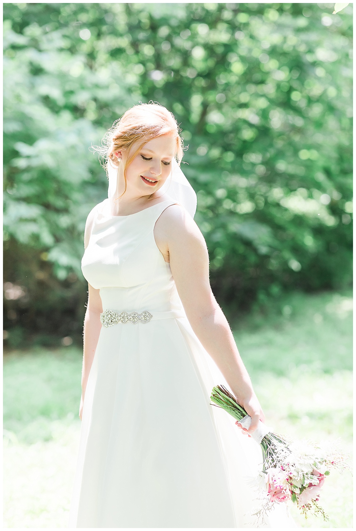 Bride with flowers photo by Simply Seeking Photography