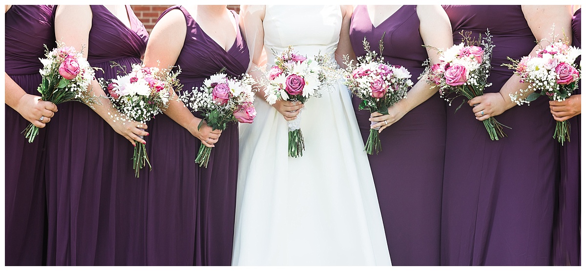Bride with flowers photo by Simply Seeking Photography