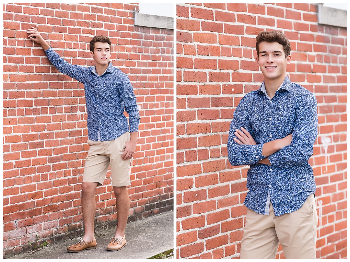 Senior guy in front of brick wall photo by Simply Seeking Photography