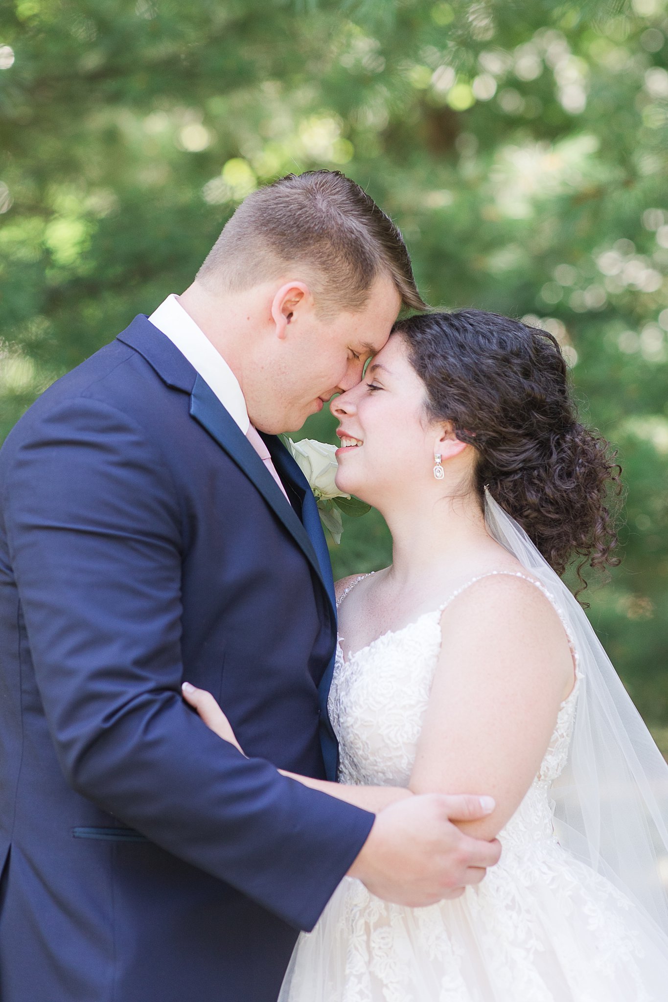 bride and groom in Hues of Rose and Navy Wedding