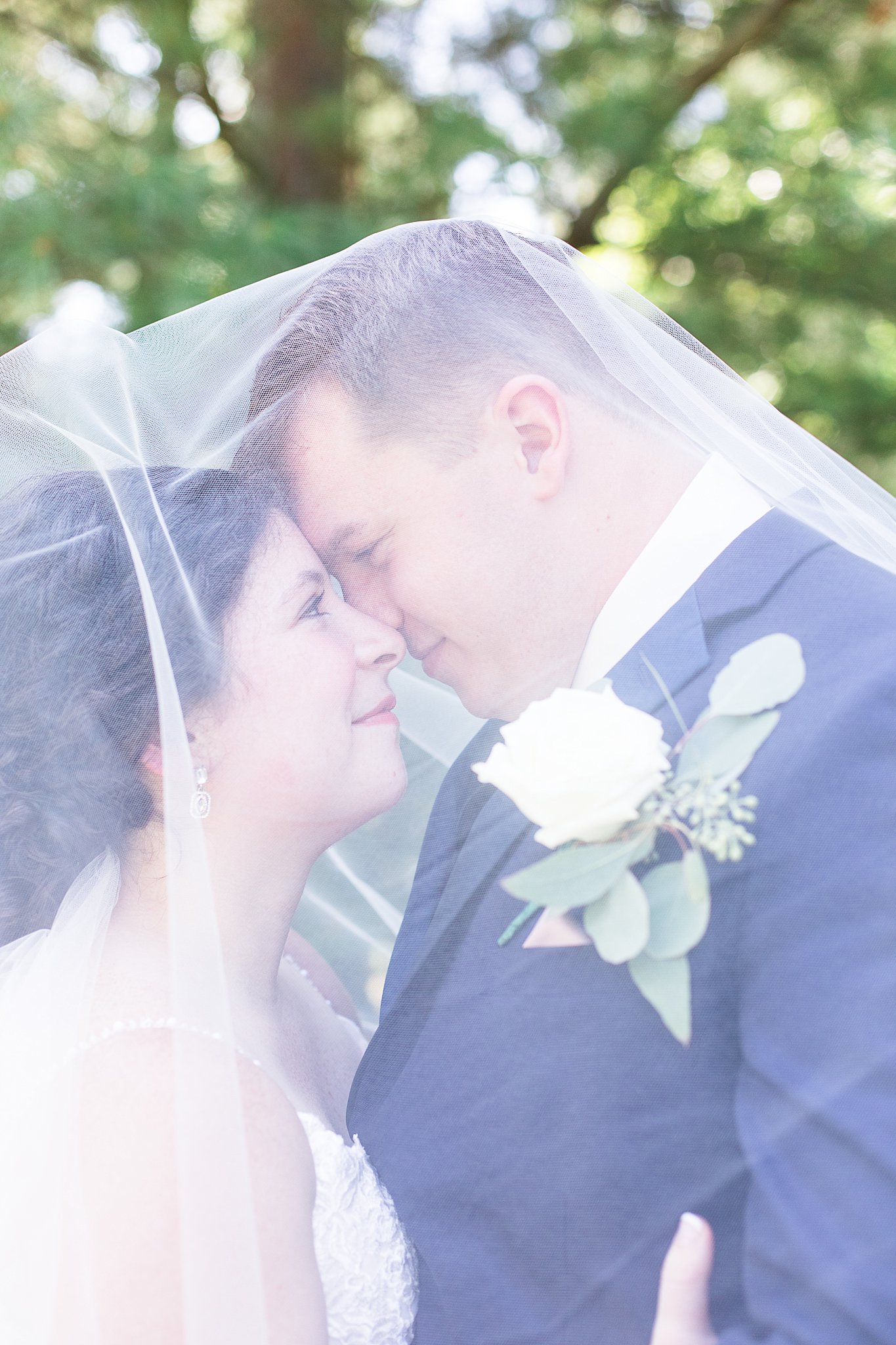 bride and groom in Hues of Rose and Navy Wedding