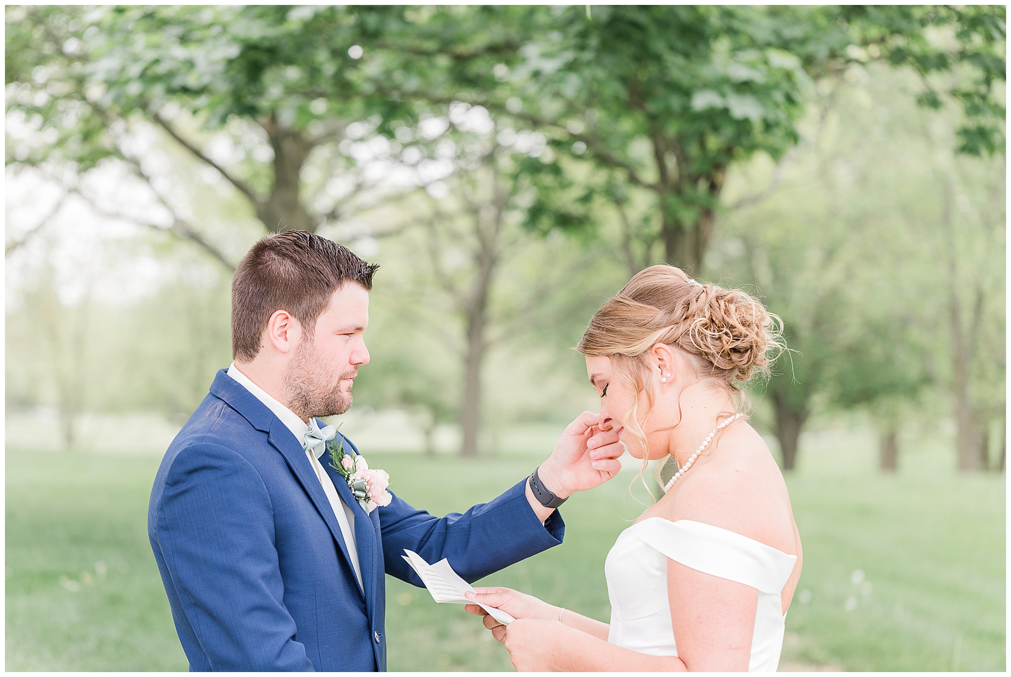 bride and groom in Sage Green and Navy Wedding