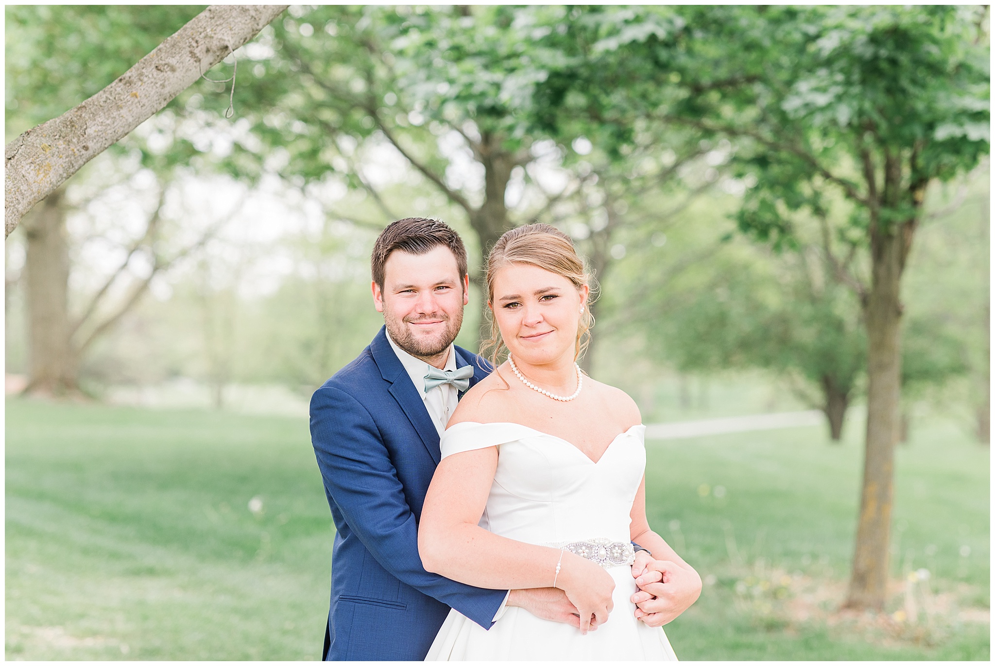 bride and groom in Sage Green and Navy Wedding Navy Wedding