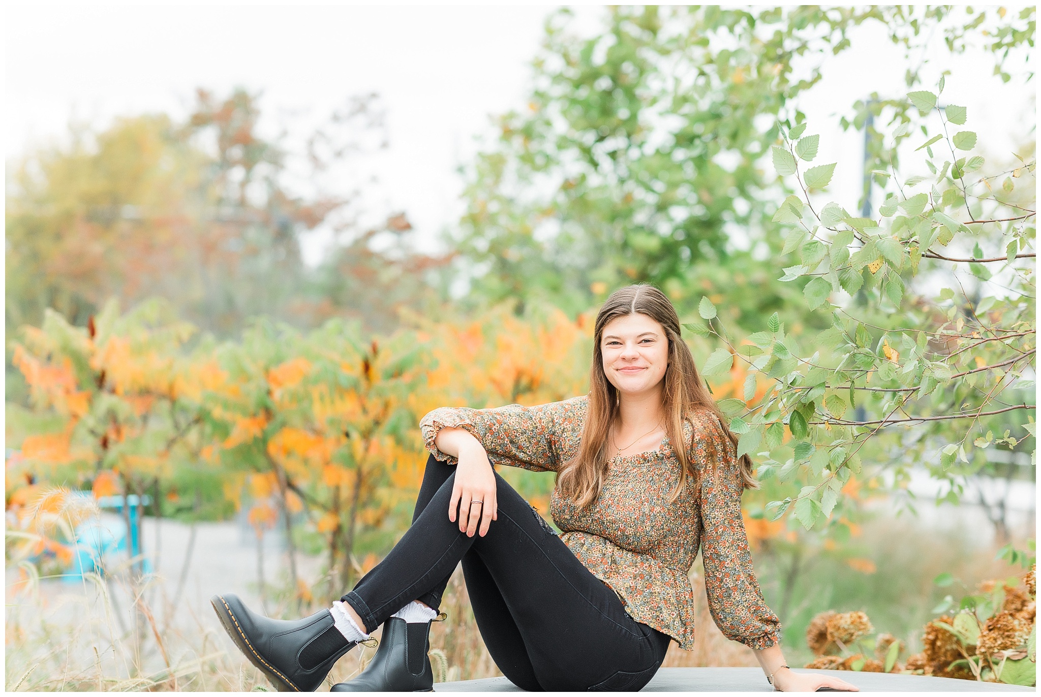 enior girl at Promenade Park downtown Fort Wayne with fall foilage