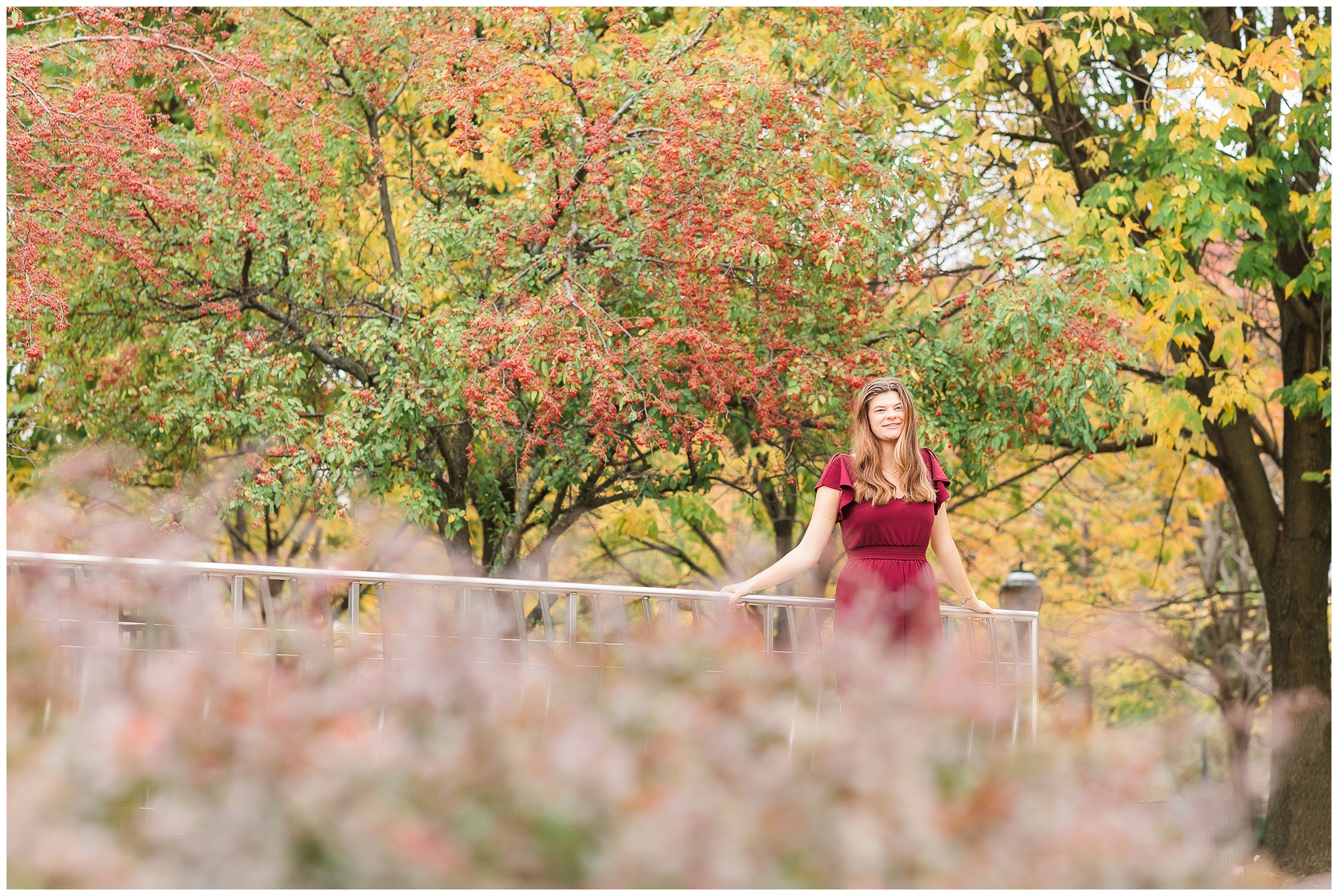 senior girl at Headwaters Park downtown Fort Wayne with fall foilage