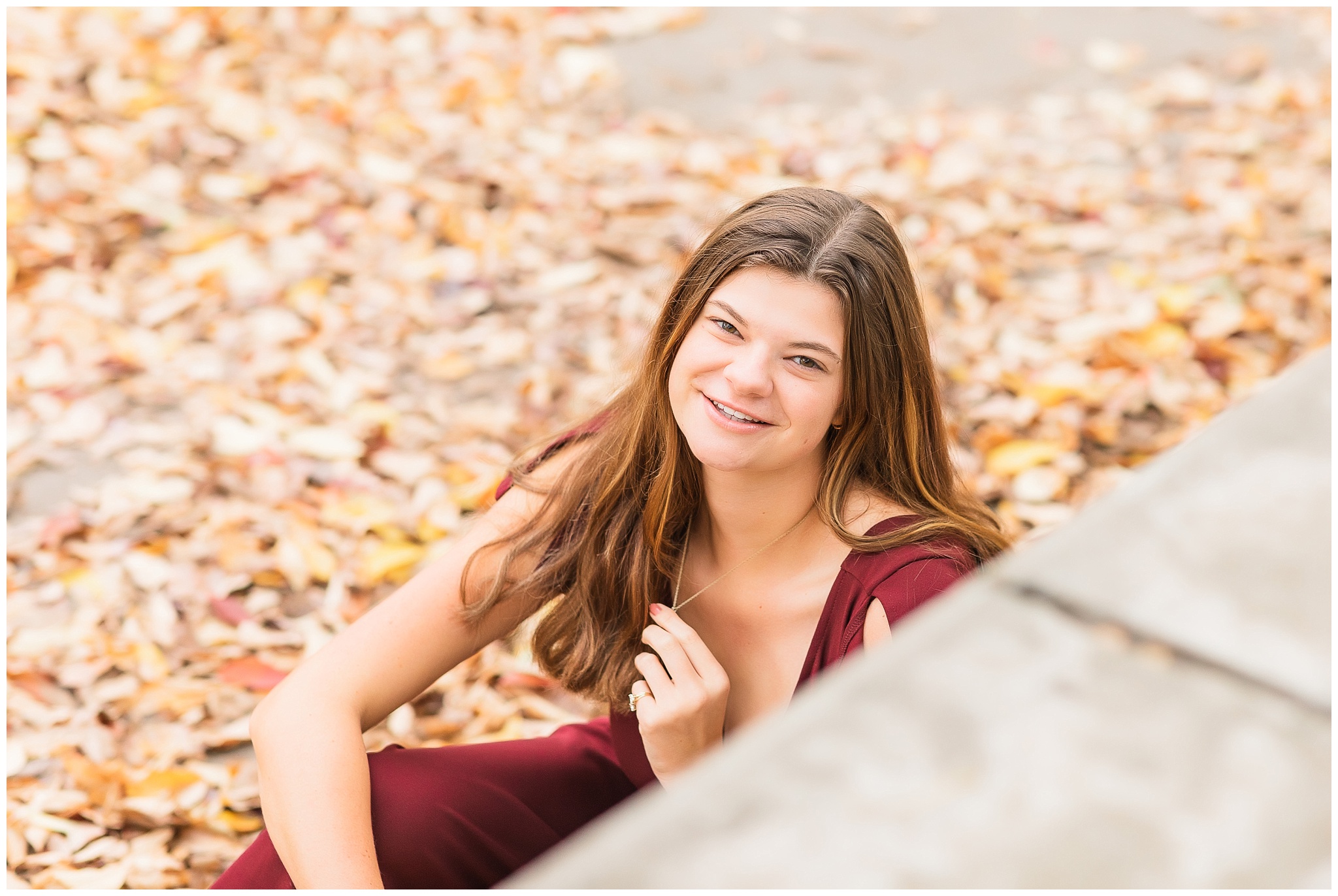 senior girl at Headwaters Park downtown Fort Wayne with fall foilage