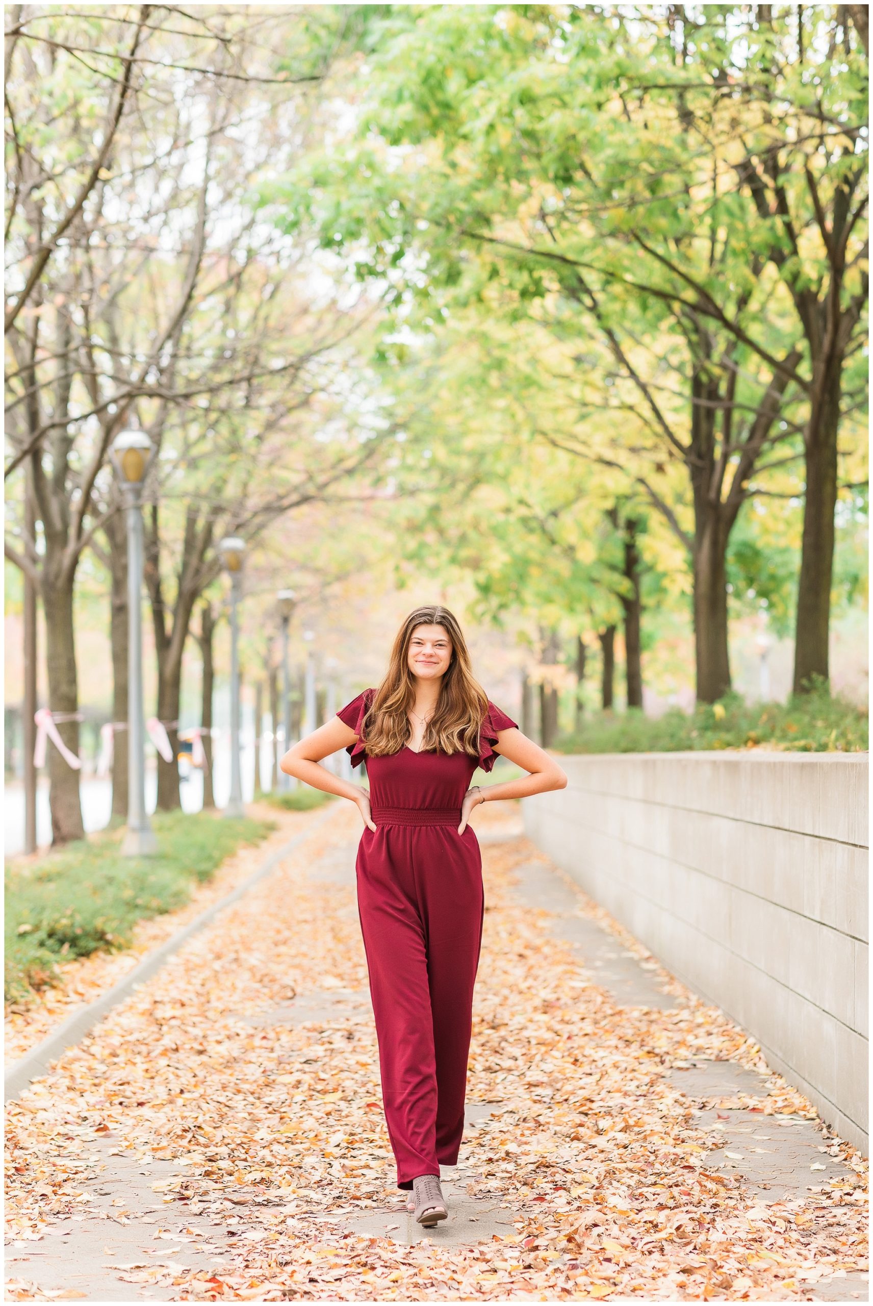senior girl at Headwaters Park downtown Fort Wayne with fall foilage