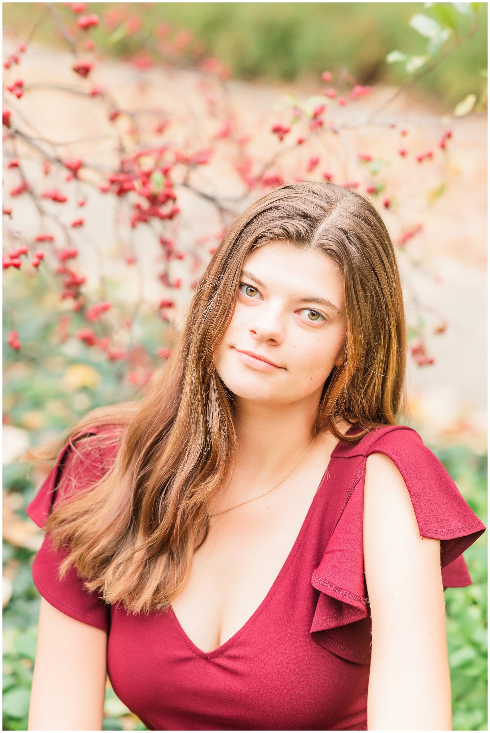 senior girl at Headwaters Park downtown Fort Wayne with fall foilage