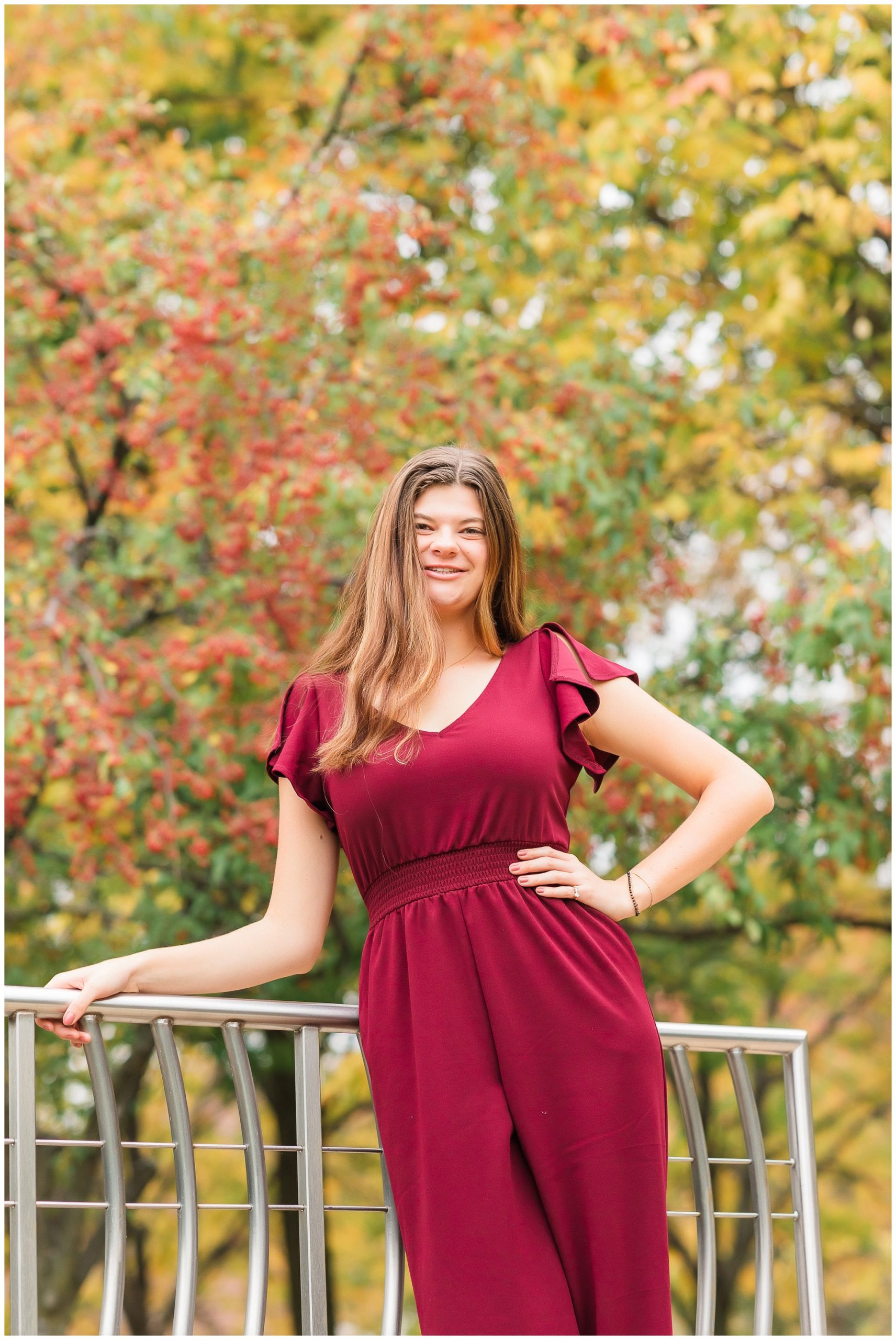 senior girl at Headwaters Park downtown Fort Wayne with fall foilage