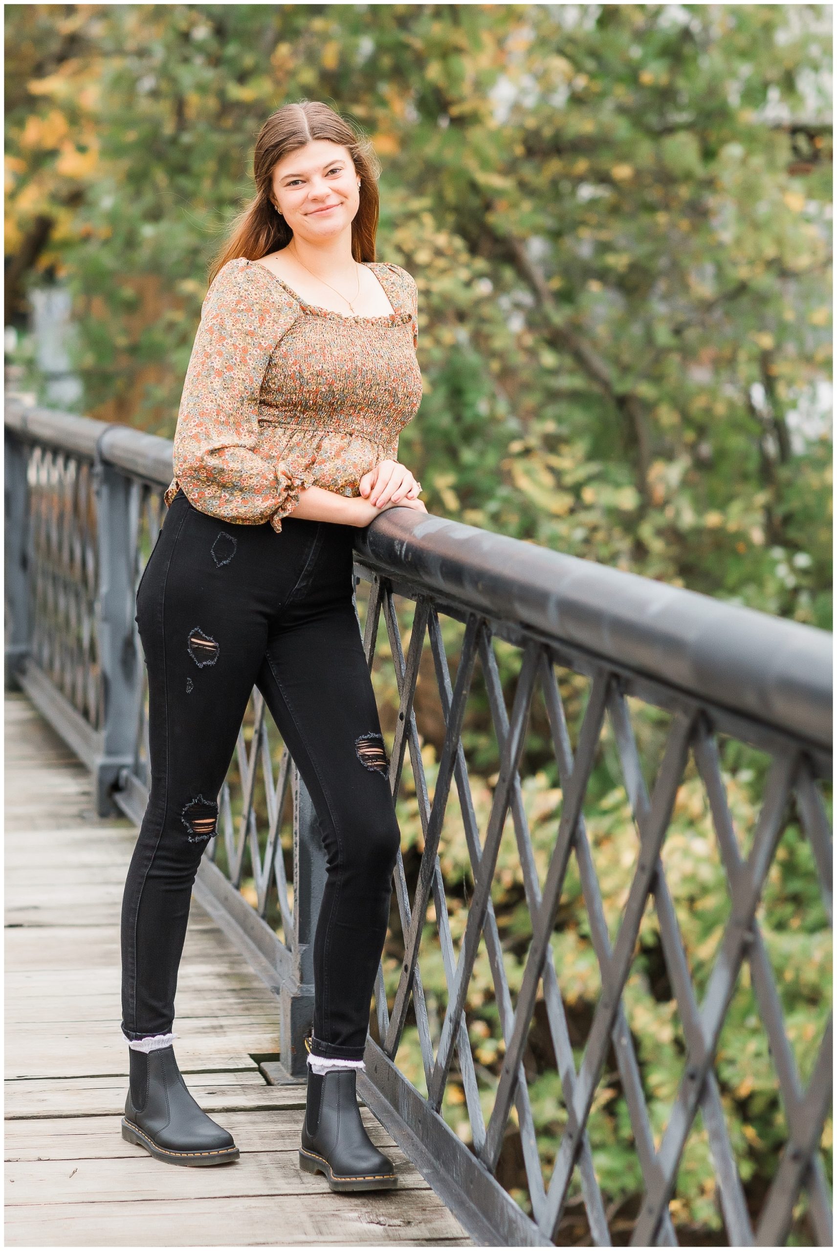 senior girl at Promenade Park downtown Fort Wayne with fall foilage