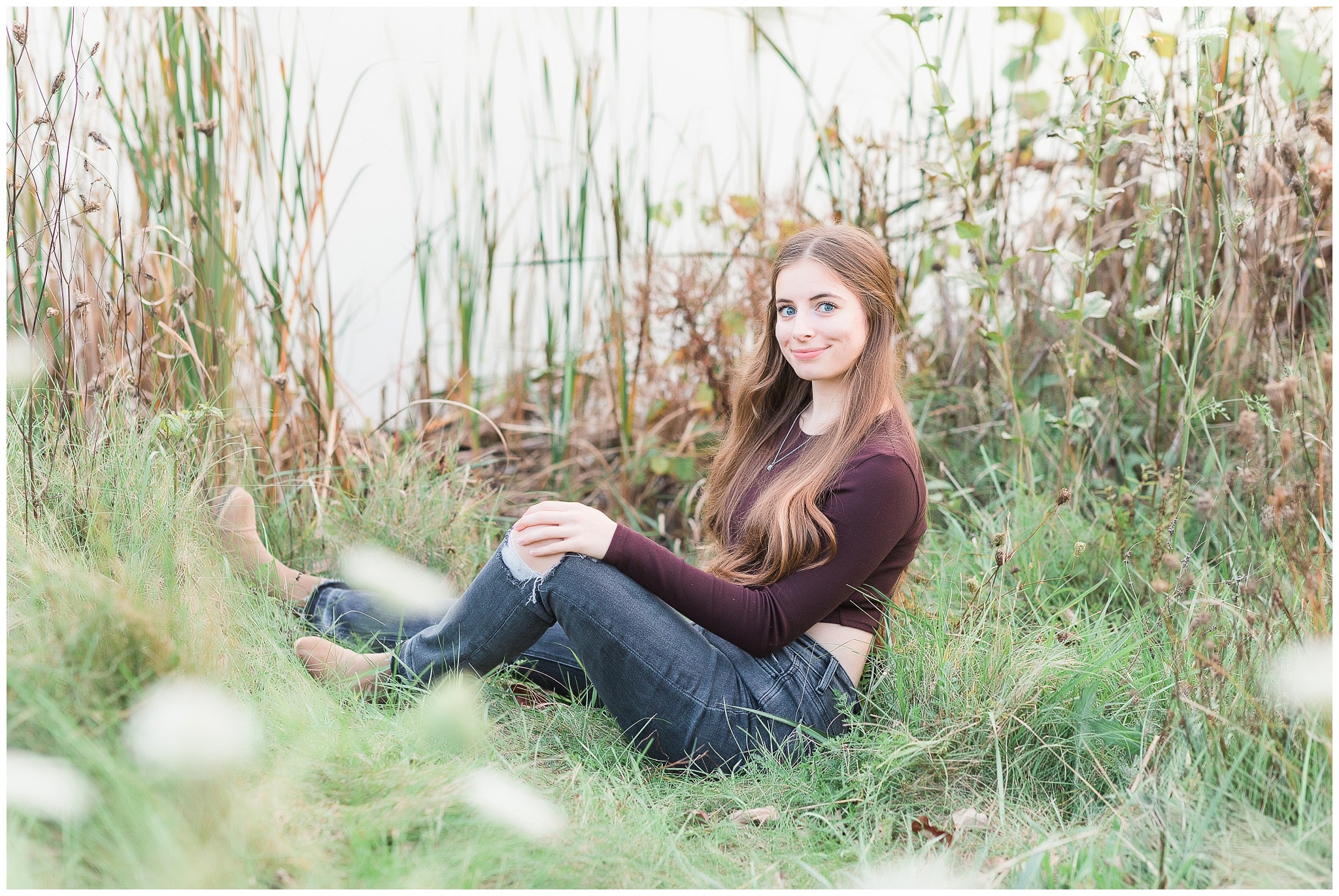 Senior girl in tall grasses at Metea Park Fall Senior Session