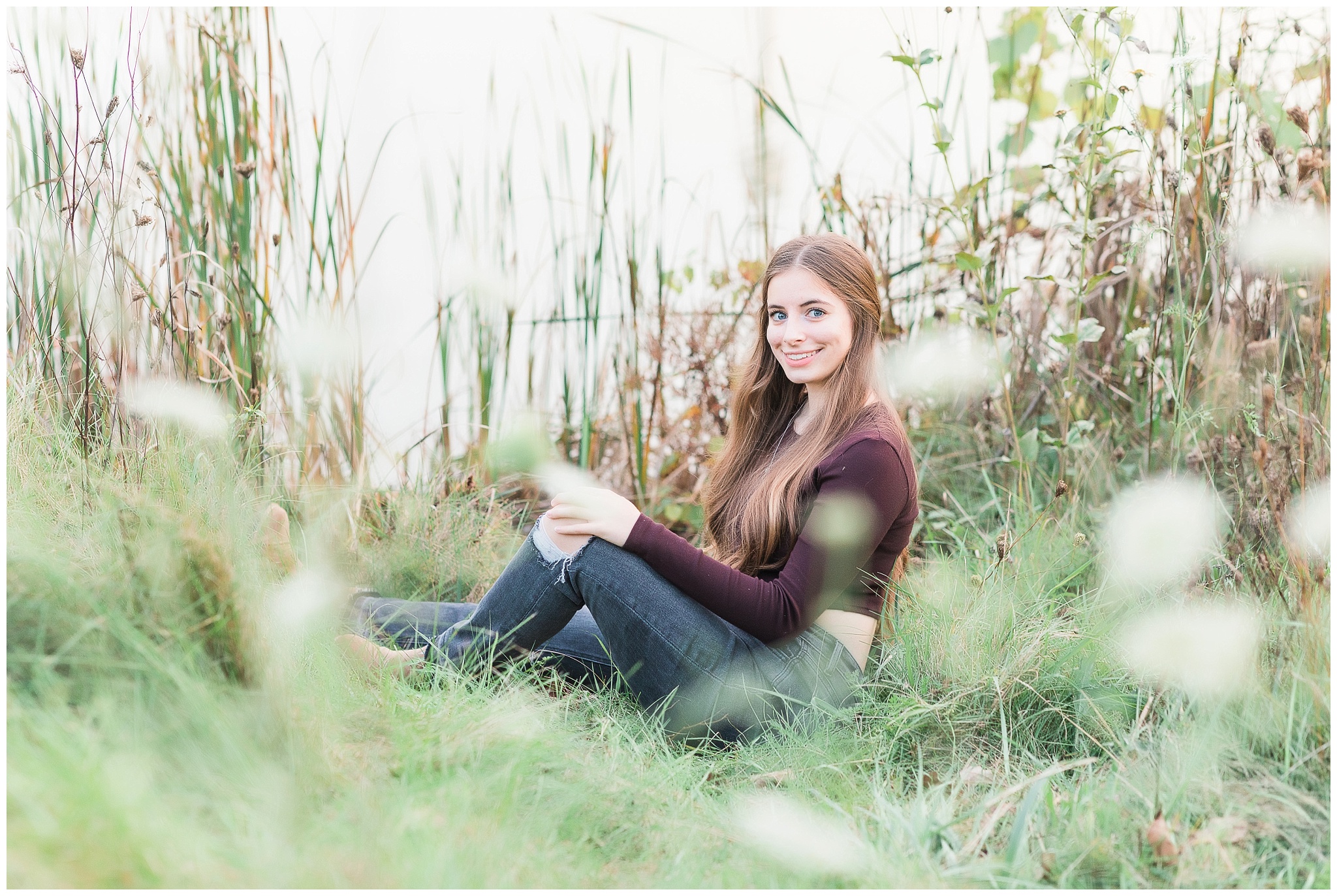 Senior girl in tall grasses at Metea Park Fall Senior Session