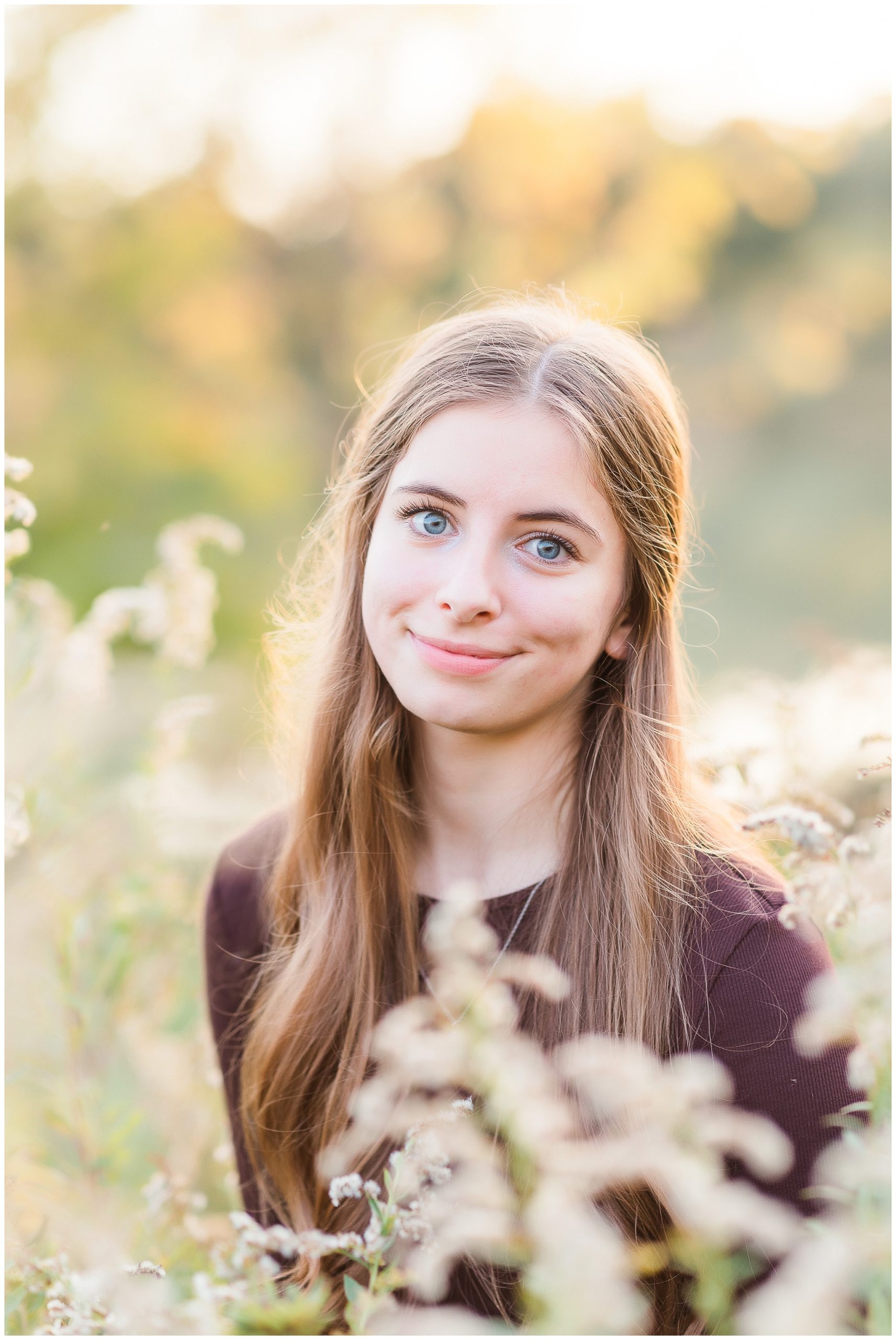 Senior girl in tall grasses at Metea Park Fall Senior Session