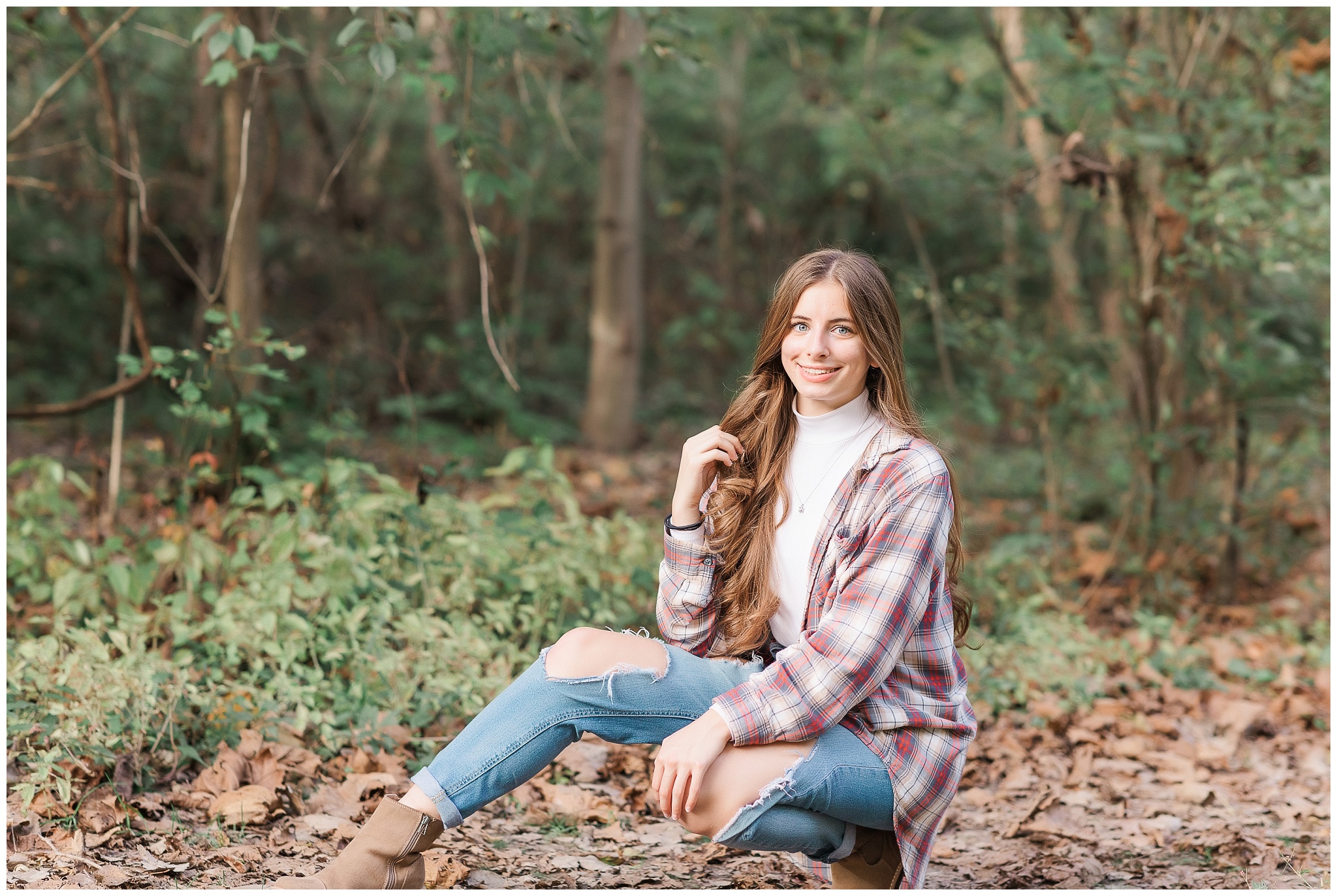 Senior girl on wooded path at Metea Park Fall Senior Session