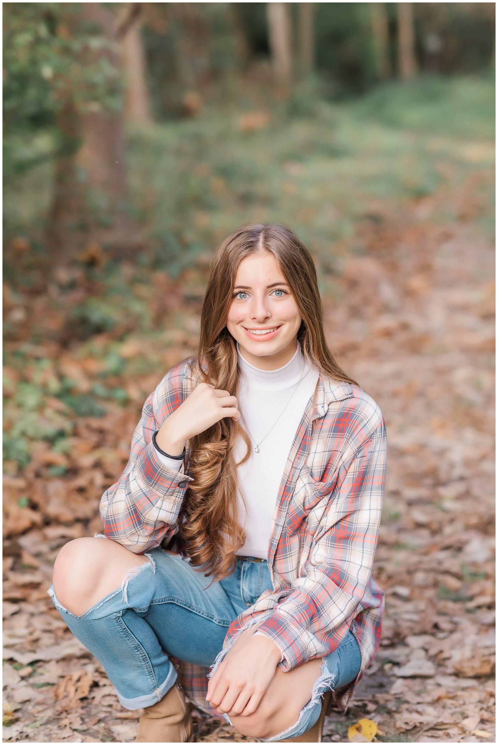 Senior girl on wooded path at Metea Park Fall Senior Session